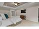 Main bedroom with a ceiling fan, television and decorative chest at 2601 Boulder Way, Woodstock, GA 30188
