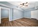 The basement features hardwood floors, fresh paint, and separate access to the outside at 548 Myrtle Trace Ln, Suwanee, GA 30024