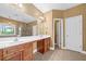A luxurious bathroom boasts a double vanity, a large mirror, and access to the shower area at 548 Myrtle Trace Ln, Suwanee, GA 30024