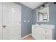 Bathroom features a white vanity with a framed mirror and three-bulb light fixture at 548 Myrtle Trace Ln, Suwanee, GA 30024
