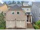 Charming brick-front home with a two-car garage and inviting entrance at 548 Myrtle Trace Ln, Suwanee, GA 30024