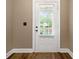 A well-lit front door includes mini blinds at 548 Myrtle Trace Ln, Suwanee, GA 30024