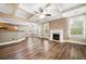 Open living space with coffered ceilings, fireplace, and hardwood floors at 548 Myrtle Trace Ln, Suwanee, GA 30024