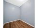 Unfurnished room features hardwood floors, white trim, and fresh paint at 548 Myrtle Trace Ln, Suwanee, GA 30024