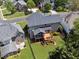 Aerial view of a home's backyard featuring a wooden deck, screened porch, and well-maintained lawn at 1632 Chadwick Ridge Dr, Lawrenceville, GA 30043