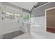 Bright bathroom features glass shower, modern tub, and natural light at 1632 Chadwick Ridge Dr, Lawrenceville, GA 30043
