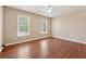 Bedroom featuring hardwood floors, large windows, and neutral paint at 1632 Chadwick Ridge Dr, Lawrenceville, GA 30043