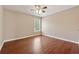 Bedroom with hardwood floors, natural light and a ceiling fan at 1632 Chadwick Ridge Dr, Lawrenceville, GA 30043