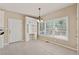 Bright breakfast area with built-in hutch, large windows, and access to the deck at 1632 Chadwick Ridge Dr, Lawrenceville, GA 30043