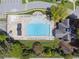 Aerial view of a community pool with ample lounge seating and surrounding green space at 1632 Chadwick Ridge Dr, Lawrenceville, GA 30043