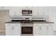 Modern kitchen featuring stainless steel appliances, white cabinets, and stylish countertops at 1632 Chadwick Ridge Dr, Lawrenceville, GA 30043