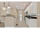 Kitchen with white cabinets, stainless appliances, granite countertops, and tile flooring at 1632 Chadwick Ridge Dr, Lawrenceville, GA 30043