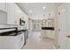 Gourmet kitchen featuring stainless appliances, custom cabinetry, and granite countertops at 1632 Chadwick Ridge Dr, Lawrenceville, GA 30043