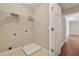 Laundry room with shelving and hardwood floors at 1632 Chadwick Ridge Dr, Lawrenceville, GA 30043