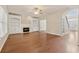 Cozy living room with hardwood floors, built-in bookshelves, a fireplace, and ample natural light at 1632 Chadwick Ridge Dr, Lawrenceville, GA 30043