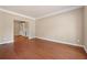 Spacious living room featuring hardwood floors and neutral paint, offering a versatile living space at 1632 Chadwick Ridge Dr, Lawrenceville, GA 30043