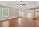 Bright and airy main bedroom with tray ceiling, hardwood floors, and ensuite bathroom access at 1632 Chadwick Ridge Dr, Lawrenceville, GA 30043