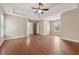 Large main bedroom featuring a tray ceiling, hardwood floors, and a walk-in closet at 1632 Chadwick Ridge Dr, Lawrenceville, GA 30043