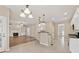 Inviting open floorplan with a fireplace and a kitchen featuring granite countertops at 1632 Chadwick Ridge Dr, Lawrenceville, GA 30043