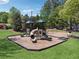 A community playground with multiple play structures, swings, and a surrounding grassy area at 1632 Chadwick Ridge Dr, Lawrenceville, GA 30043