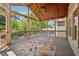 Inviting screened porch with vaulted ceiling, string lights, fan, and an area rug creating a cozy outdoor space at 1632 Chadwick Ridge Dr, Lawrenceville, GA 30043