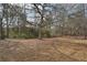 Extensive backyard with mature trees providing natural beauty and a sense of privacy at 2426 Windridge Dr, Conyers, GA 30013