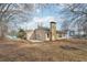 Spacious backyard with a slight slope and mature trees on the property at 2426 Windridge Dr, Conyers, GA 30013