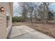 Backyard view showing a stone paver patio perfect for outdoor gatherings near the home at 2426 Windridge Dr, Conyers, GA 30013