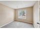 Neutral bedroom with a window providing natural light, carpeted floor and textured ceiling at 2426 Windridge Dr, Conyers, GA 30013