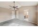 Spacious bedroom with carpeted floor, high ceilings, fan and view to bathroom at 2426 Windridge Dr, Conyers, GA 30013
