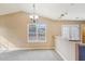 Bright dining room area with a large window and access to the kitchen, perfect for entertaining at 2426 Windridge Dr, Conyers, GA 30013