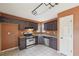 Bright kitchen with stainless steel appliances and tile floors, offering a clean and modern feel at 2426 Windridge Dr, Conyers, GA 30013