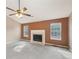 Living room featuring carpet floors, fireplace, and lots of natural light at 2426 Windridge Dr, Conyers, GA 30013