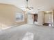Open-concept floorplan with living room, kitchen, and dining areas at 2426 Windridge Dr, Conyers, GA 30013
