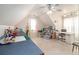 Spacious attic room with light tile flooring and storage space at 2920 Stanway Ave, Douglasville, GA 30135