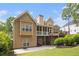 Spacious back exterior view featuring multi-level decks, a covered patio, and well-maintained lawn at 2920 Stanway Ave, Douglasville, GA 30135