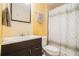 Bathroom featuring cabinet sink, toilet, towel racks, and shower with curtain at 2920 Stanway Ave, Douglasville, GA 30135