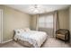 Cozy bedroom features a comfortable bed, soft carpet, and a seating area near the window at 2920 Stanway Ave, Douglasville, GA 30135