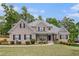 Charming brick home with manicured lawn and mature trees in a desirable neighborhood at 2920 Stanway Ave, Douglasville, GA 30135