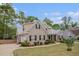 Well-maintained brick house featuring a front yard, driveway, and mature landscaping at 2920 Stanway Ave, Douglasville, GA 30135