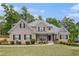 Charming brick home featuring a manicured lawn and inviting front porch at 2920 Stanway Ave, Douglasville, GA 30135