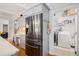 Kitchen features stainless refrigerator and access to the laundry room at 2920 Stanway Ave, Douglasville, GA 30135