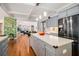 Kitchen flows to the living room and features an island with counter seating at 2920 Stanway Ave, Douglasville, GA 30135