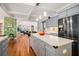 Open kitchen concept with a large island and stainless steel refrigerator at 2920 Stanway Ave, Douglasville, GA 30135
