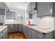 Updated kitchen features gray cabinets, stainless appliances, and white subway tile backsplash at 2920 Stanway Ave, Douglasville, GA 30135