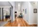 Open-concept living room with hardwood floors, fireplace, and vaulted ceilings at 2920 Stanway Ave, Douglasville, GA 30135