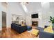 Cozy living room with fireplace, hardwood floors, and plenty of natural light at 2920 Stanway Ave, Douglasville, GA 30135