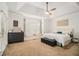 Spacious primary bedroom features a tray ceiling and plenty of natural light at 2920 Stanway Ave, Douglasville, GA 30135