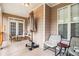 Covered porch featuring neutral-colored walls, seating, and natural light at 2920 Stanway Ave, Douglasville, GA 30135