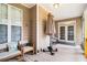 Covered porch with white ceiling, seating, and outdoor décor at 2920 Stanway Ave, Douglasville, GA 30135